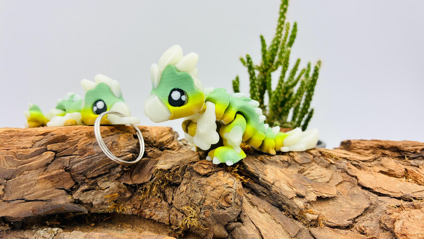 Flexi Mini Velociraptor – 3D-gedruckt | Optional als Schlüsselanhänger | Nachtleuchtend | Matcha Farben