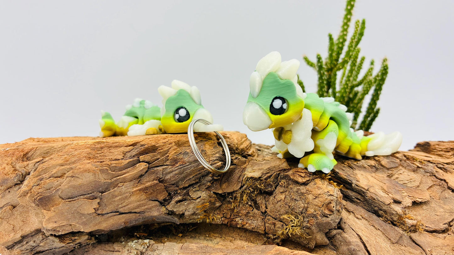 Flexi Mini Velociraptor – 3D-gedruckt | Optional als Schlüsselanhänger | Nachtleuchtend | Matcha Farben